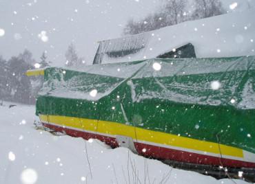 Covered boat in snowy weather